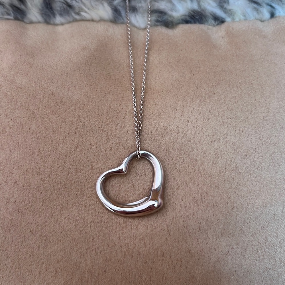 Tiffany & Co. Elsa Peretti Open Heart pendant in sterling silver with dust bag.